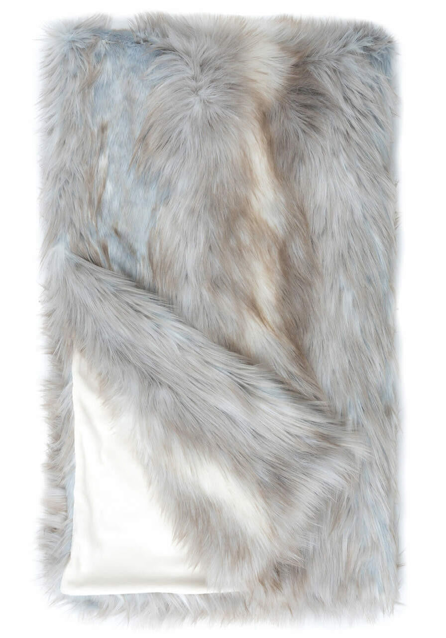 Siberian Fox faux fur throw with grey and tan tones and a white velvet lining.