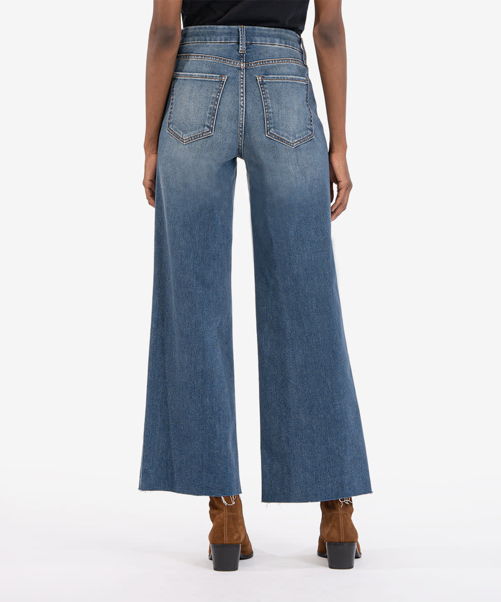 Women's high-rise wide-leg jeans in family wash with front pockets and raw hem