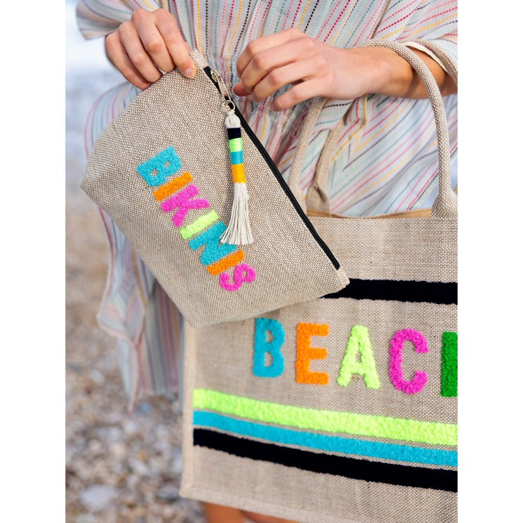 Natural jute Bikinis Zip Pouch with colorful embroidered letters and a decorative tassel.