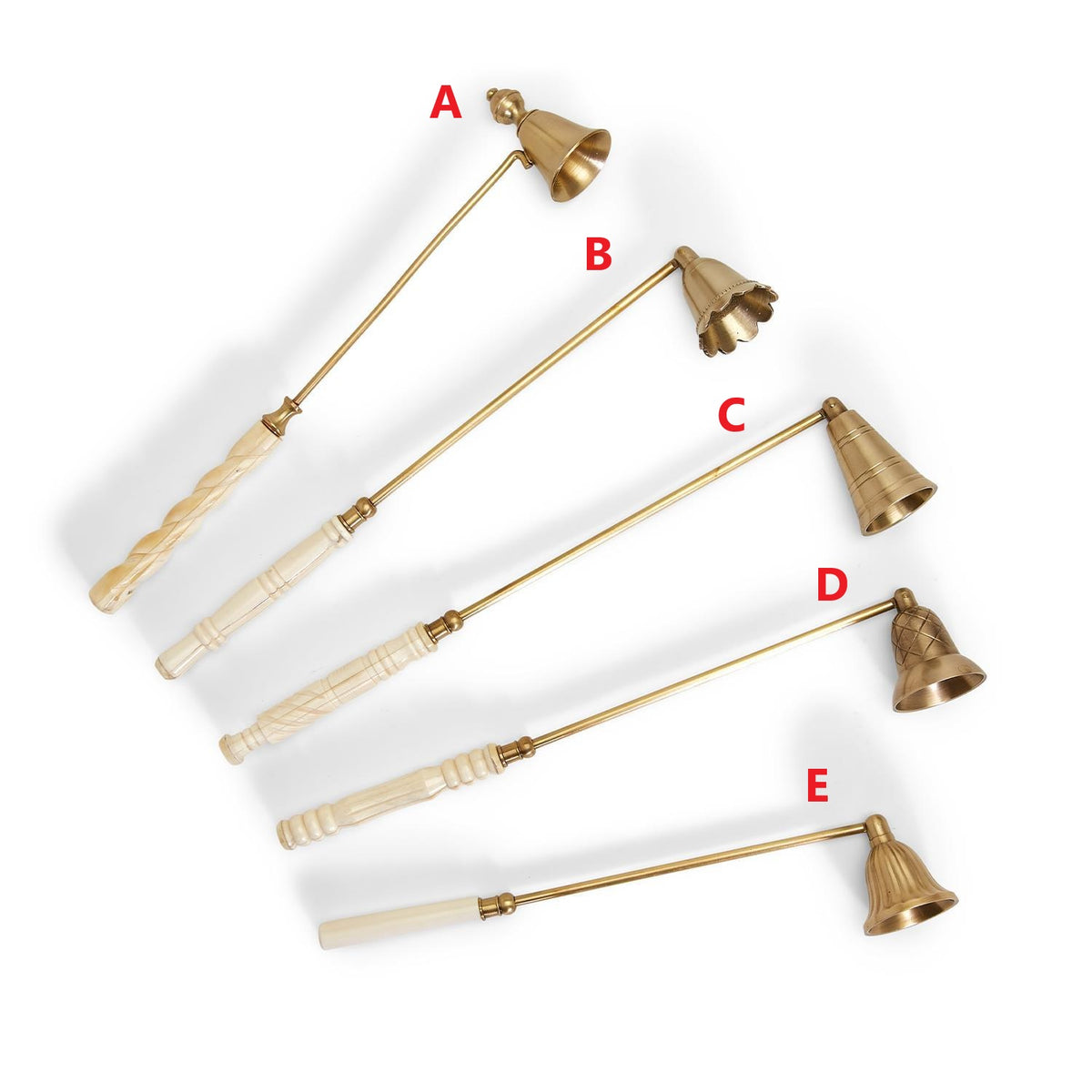 Five antiqued gold candle snuffers with carved white handles and various bell-shaped designs.