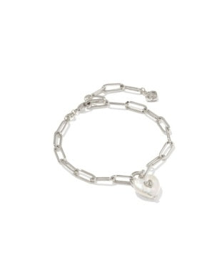 Silver paperclip chain bracelet featuring a heart-shaped pearl charm with a small metal detail.