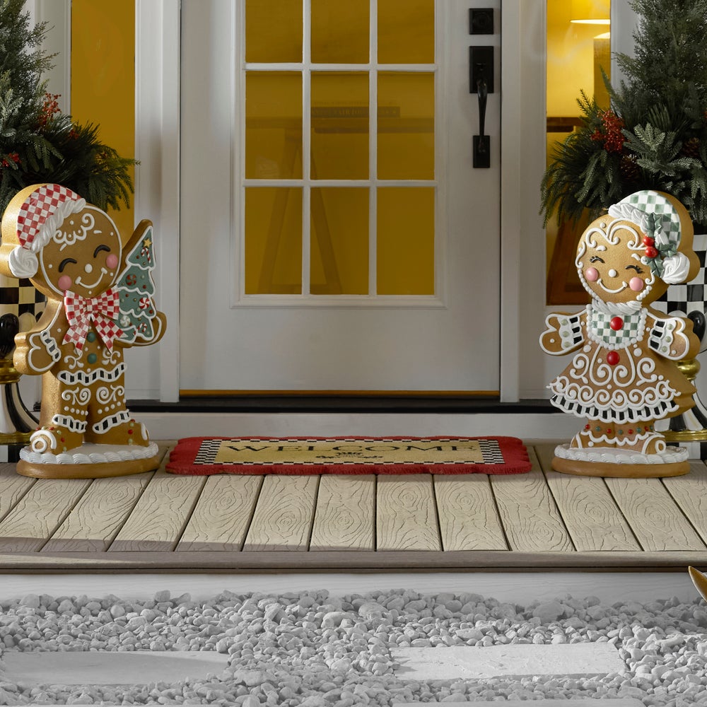 Scalloped welcome entrance mat made with coir and PVC in a natural tan color.