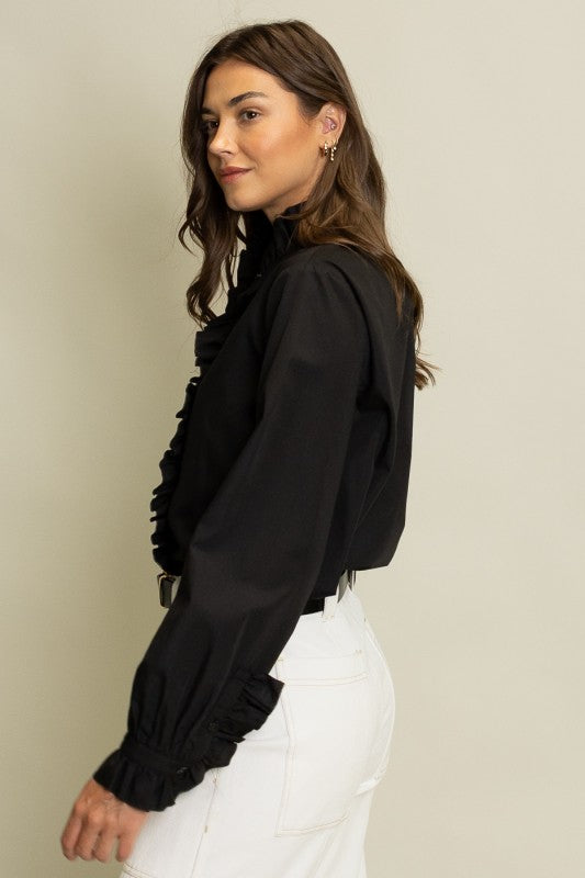 Women's Freya ruffled button-up blouse in light color with relaxed fit silhouette and long sleeves.