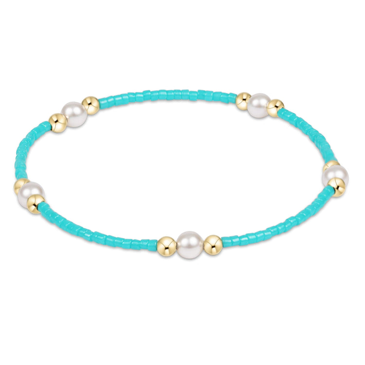 Hope Purpose Pearl Bracelet with turquoise seed beads, gold-filled beads, and white pearls.