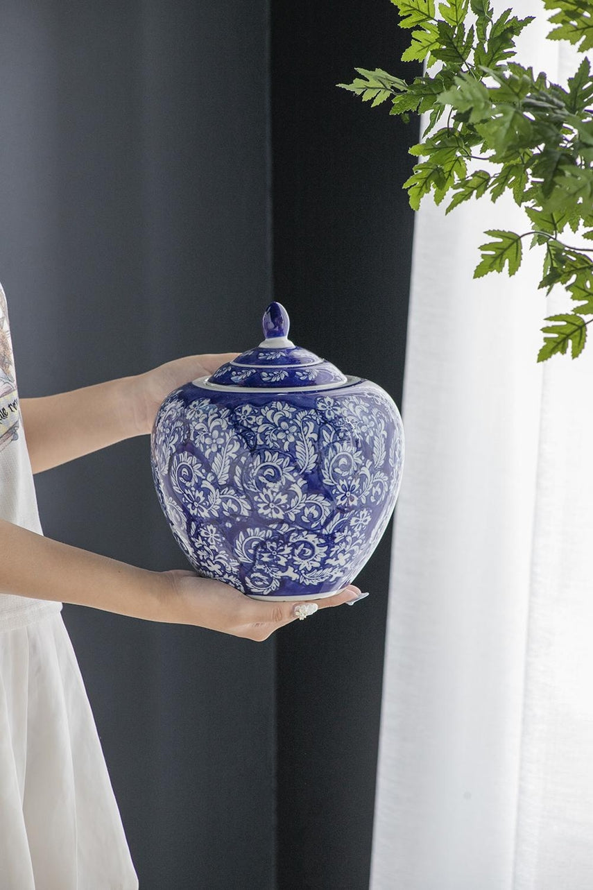 Round porcelain ginger jar in blue and white with a matching lid.
