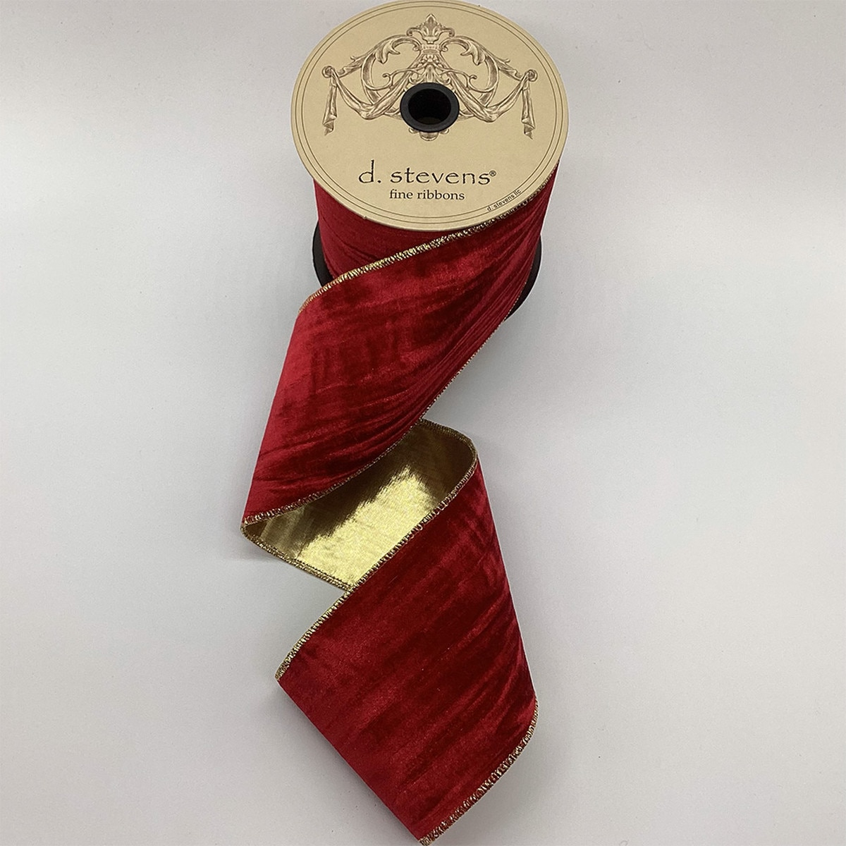 4 inch vintage red marble velvet ribbon with gold lame back on a d. stevens spool.