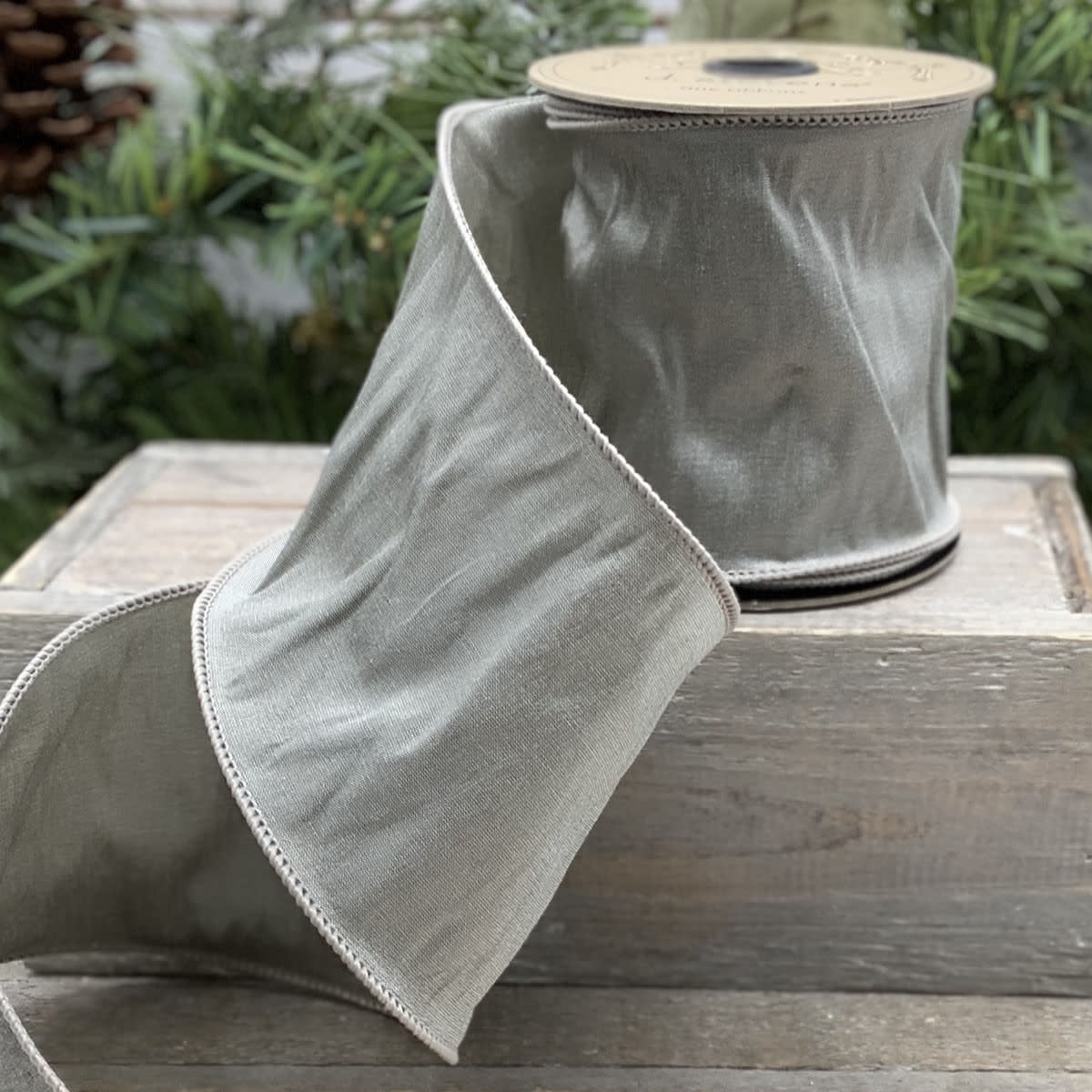 Platinum New Taffeta ribbon with a smooth satin finish.