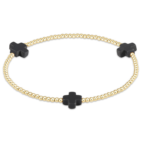 Gold-filled Signature Cross bracelet with a cross bead pattern on elastic cord.