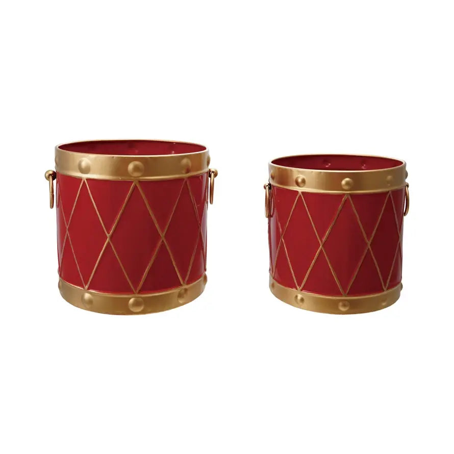 Red iron bucket with gold accents in a drum-shaped silhouette