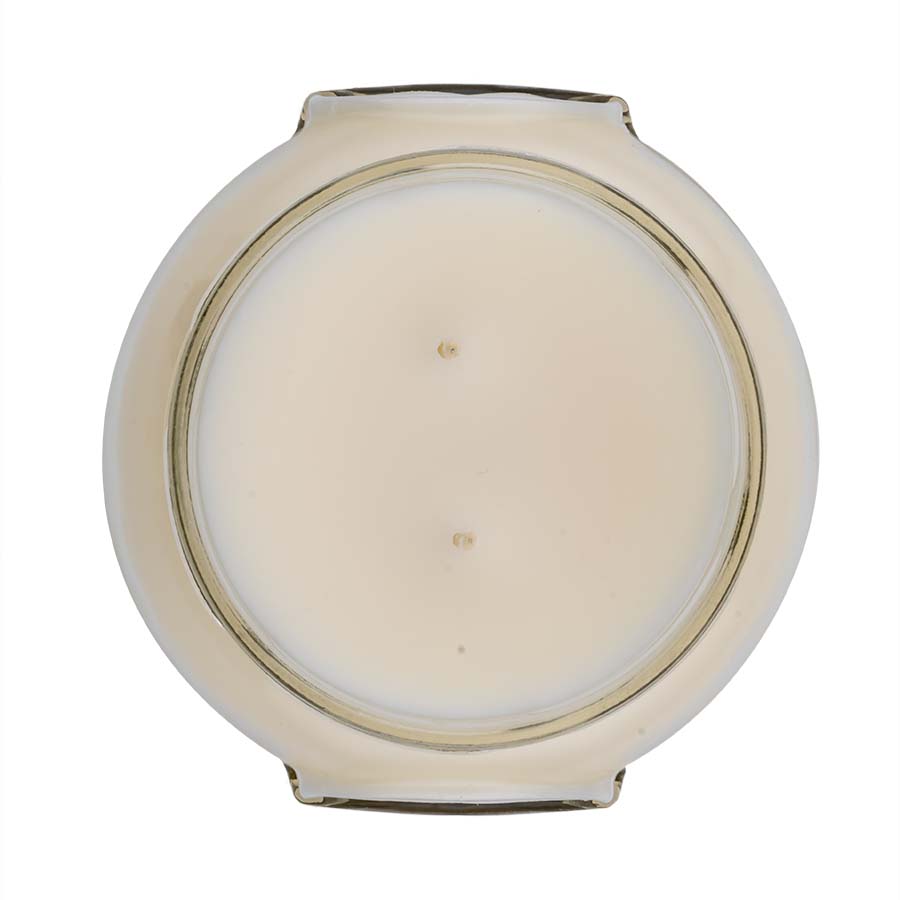 A Regal scented candle in a 22oz glass jar with a white soy/paraffin blend wax and cotton wick.