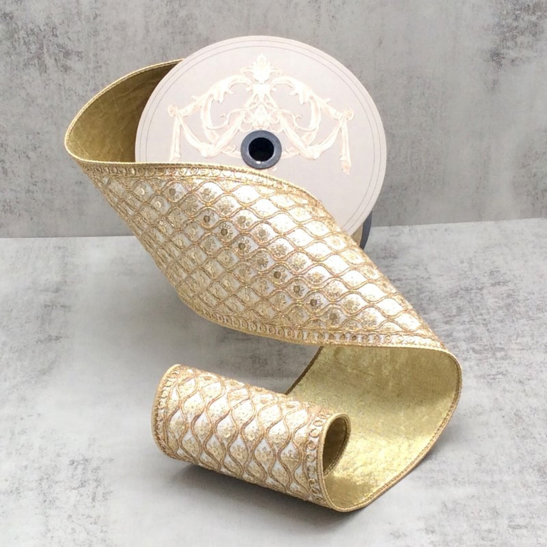 4.5-inch winter white dupion ribbon with gold sequin bullion trim and a scalloped pattern.