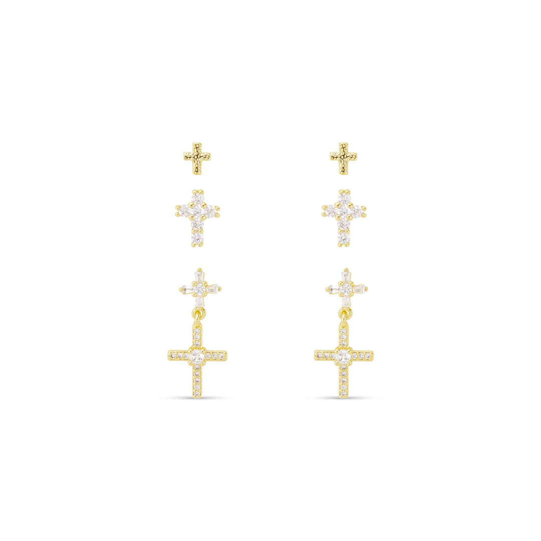 Three pairs of gold-tone cross stud and drop earrings with clear cubic zirconia accents.