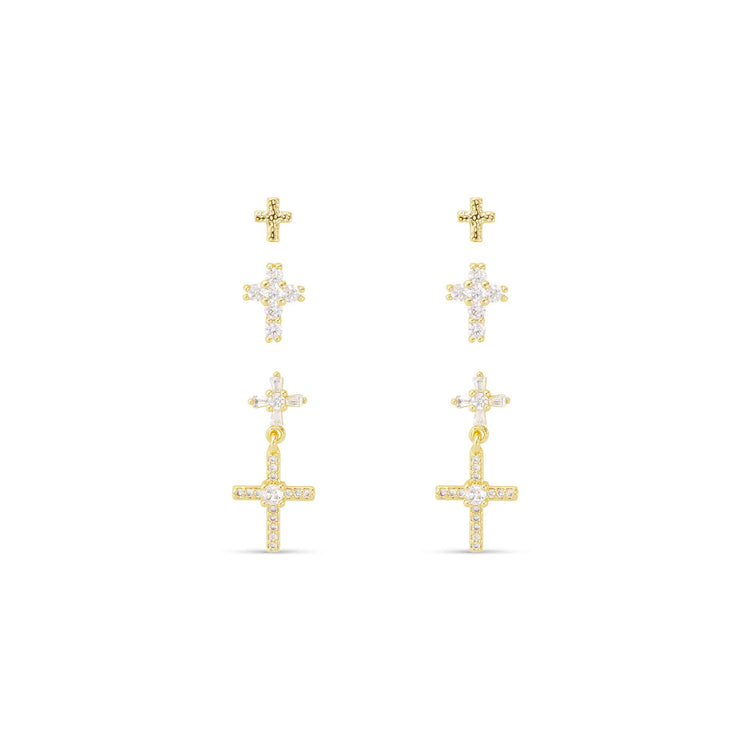 Three pairs of gold-tone cross stud and drop earrings with clear cubic zirconia accents.