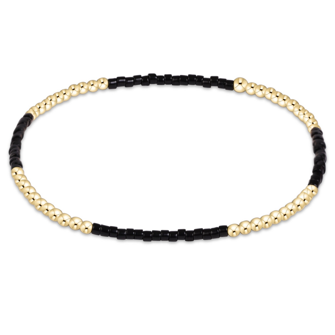 Gameday Hope Blissful Bracelet with alternating sections of black seed beads and 14kt gold beads.