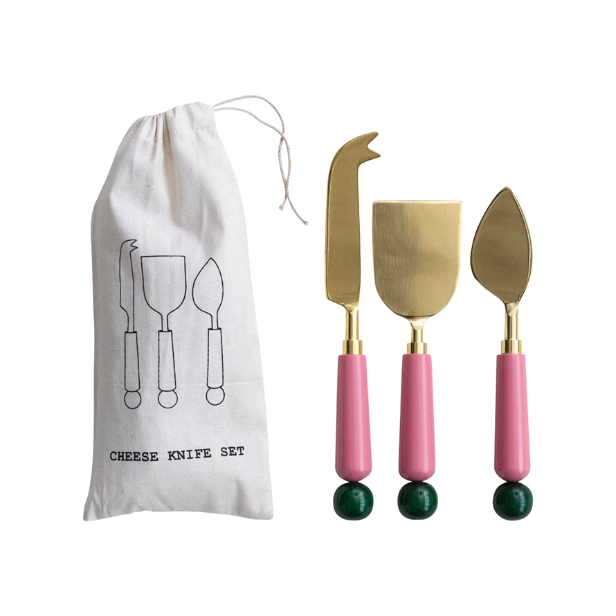 Set of stainless steel cheese knives with dark resin handles in a drawstring bag.