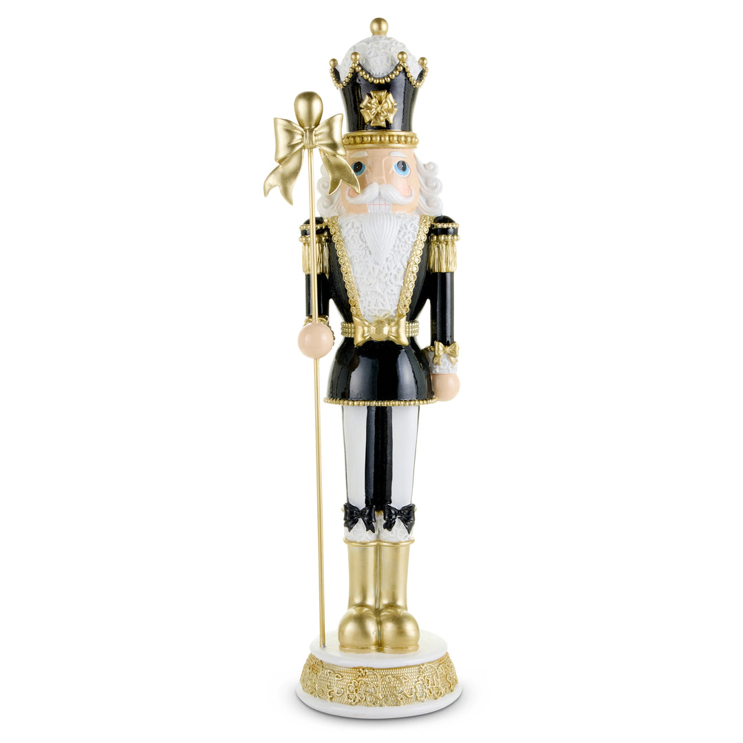 30-inch black and gold nutcracker figurine holding a staff with a gold bow.