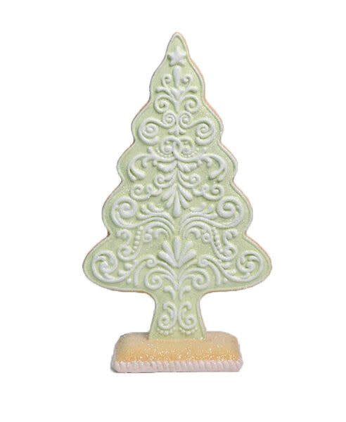 Green gingerbread tree ornament with a classic holiday shape.