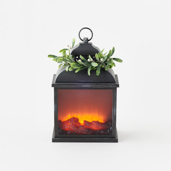 Dark grey PVC lantern with faux firelight glow topped by green mistletoe wreath.