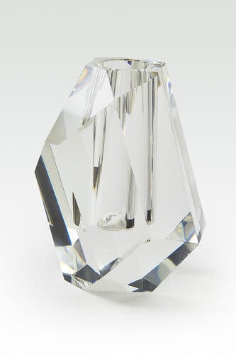 Small crystal vase with a rock-shaped silhouette in clear glass.