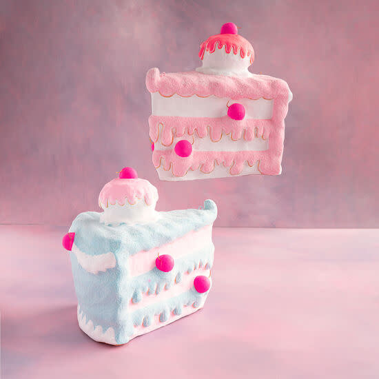 Paper mache slice cake display in white with realistic frosting texture.