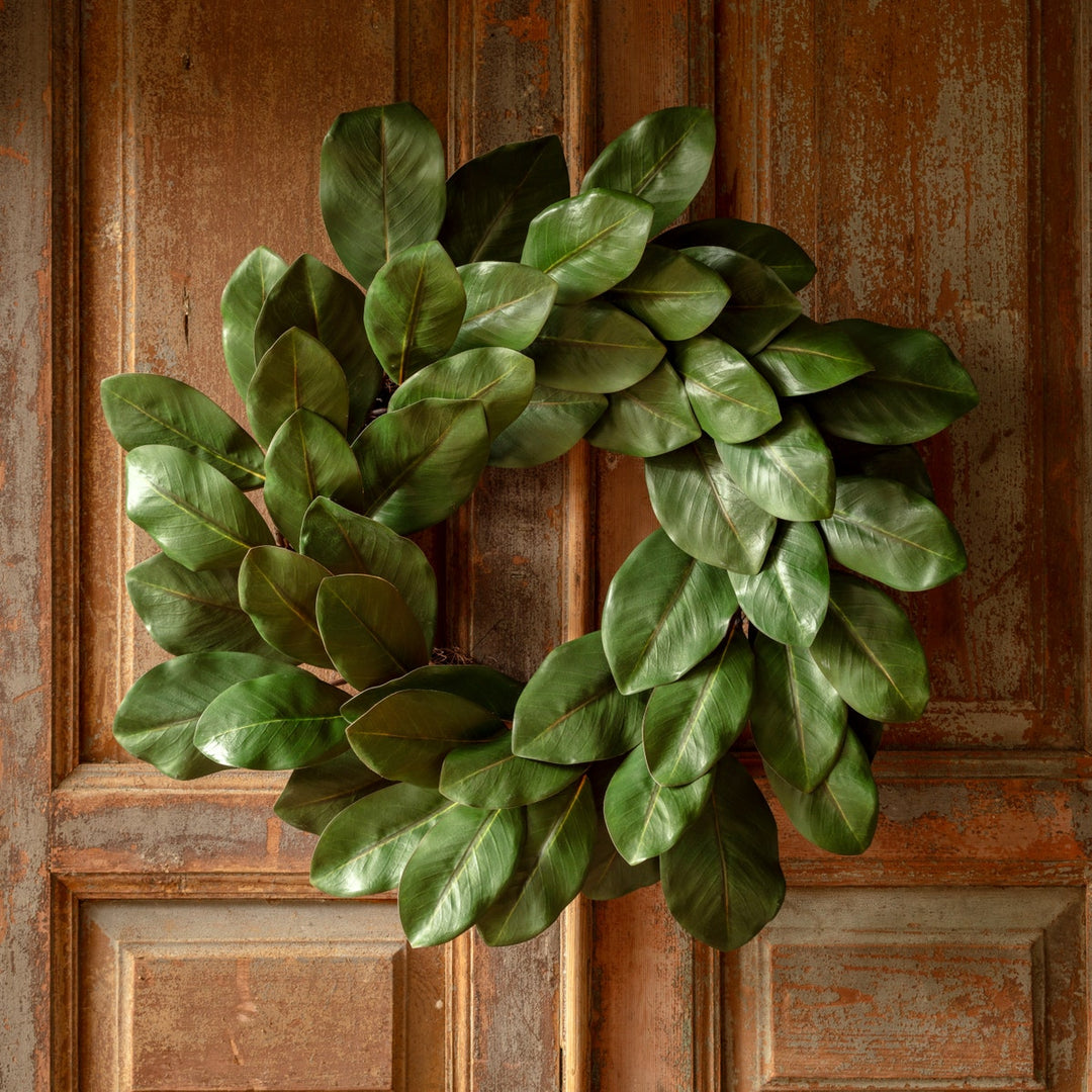 Round Monticello Magnolia wreath with natural green foliage and cream-colored magnolia flower accents.