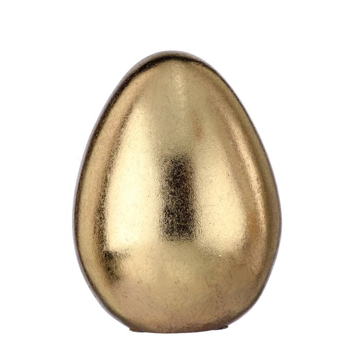Resin golden egg with a smooth metallic finish