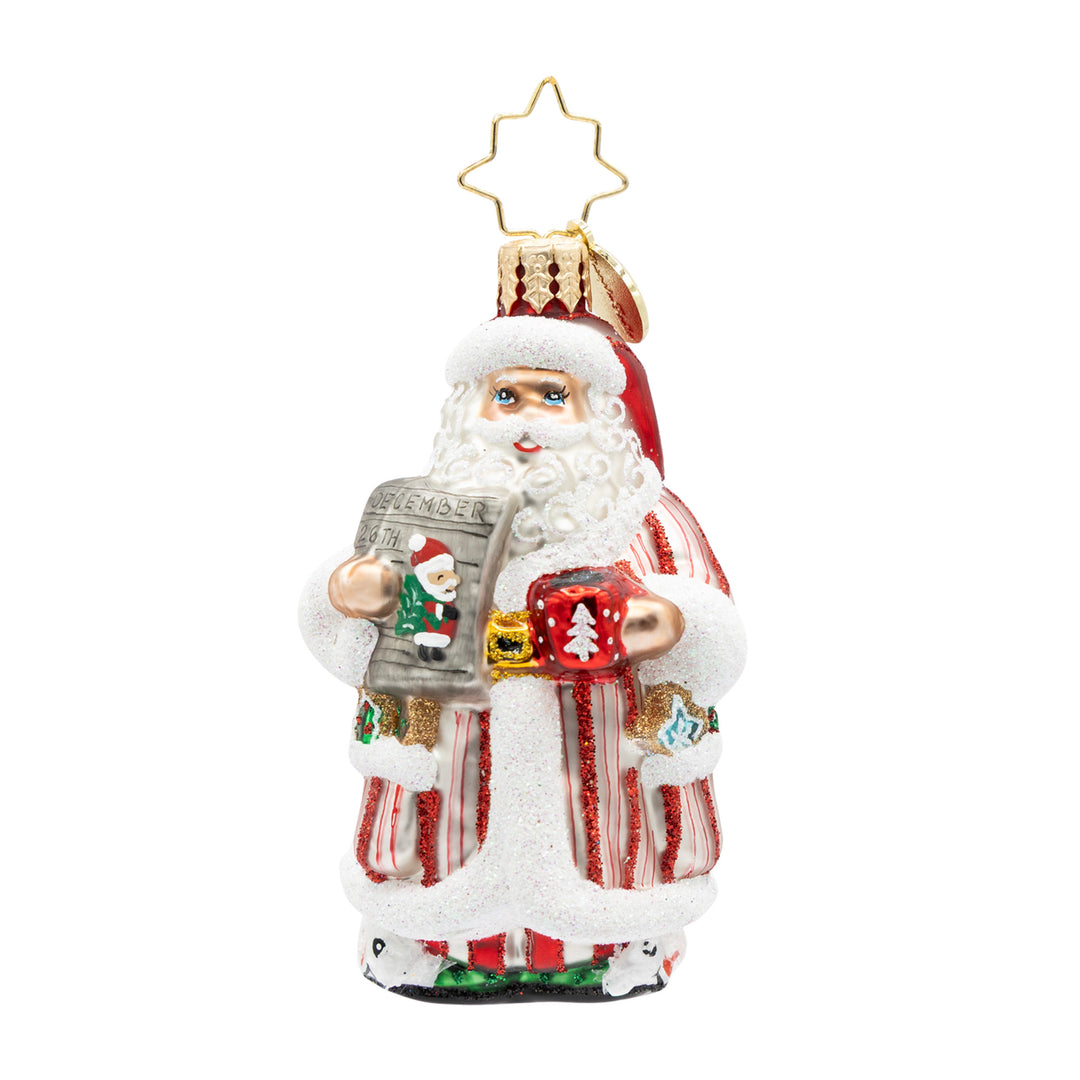 Santa's Daily News Gem glass ornament featuring Santa holding a newspaper and a red mug.