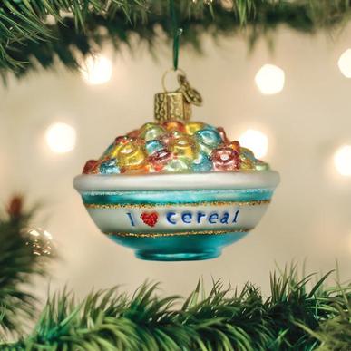 Glass bowl of cereal ornament hanging on a Christmas tree with 'I heart cereal' text.