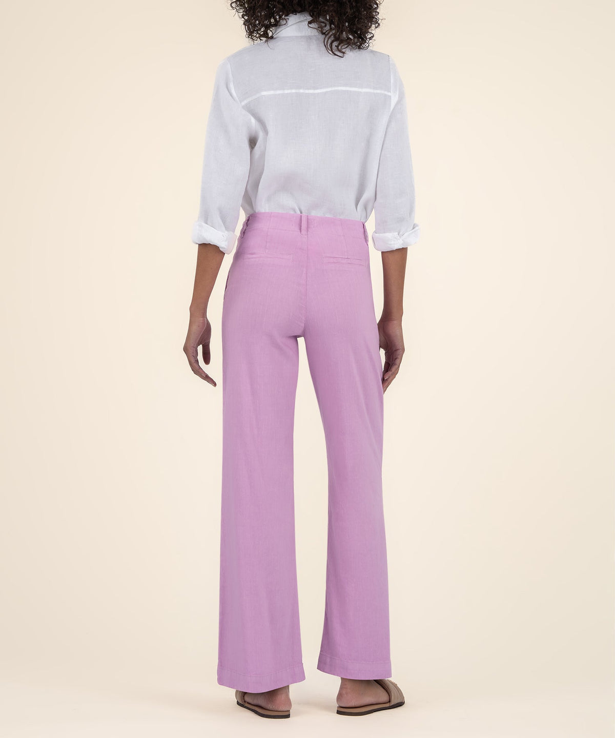 Meg Linen high rise wide leg pants in soft neutral tone with relaxed silhouette.