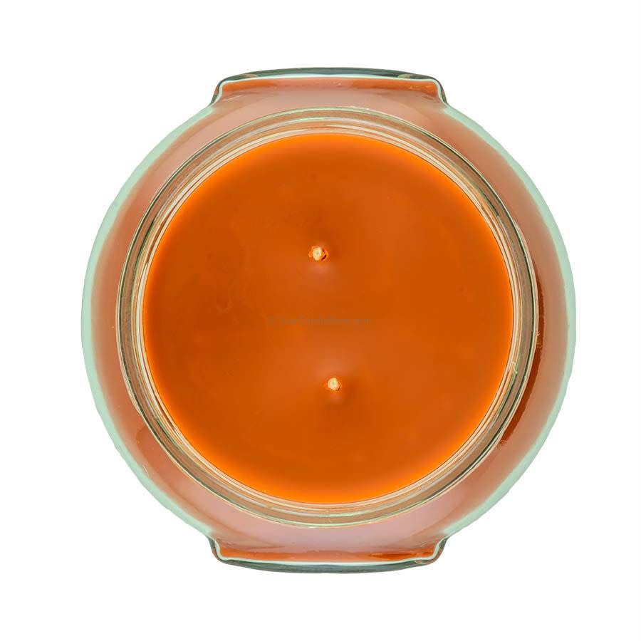 A white ceramic jar containing a Tyler Candle with visible wax surface.