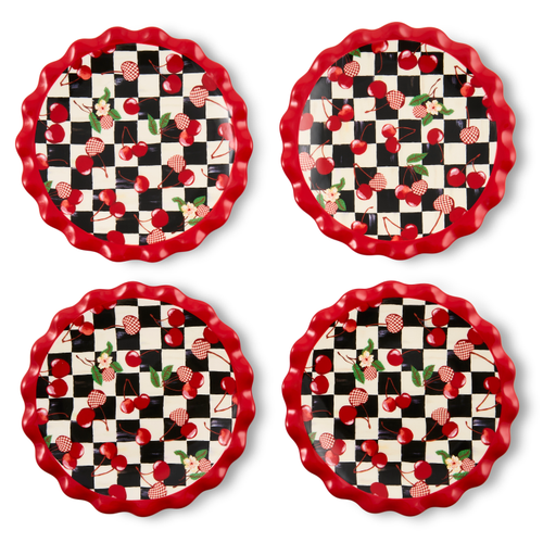 Set of four small plates with a red ruffled edge and a black and white checkered cherry pattern.