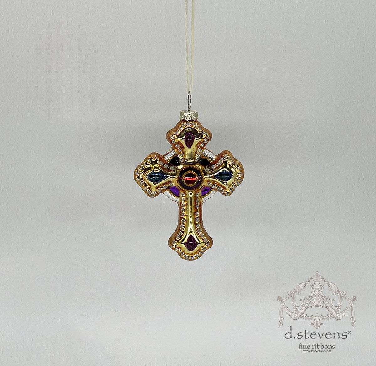4.75-inch dark gold glass cross ornament with purple and blue gem-tone accents.