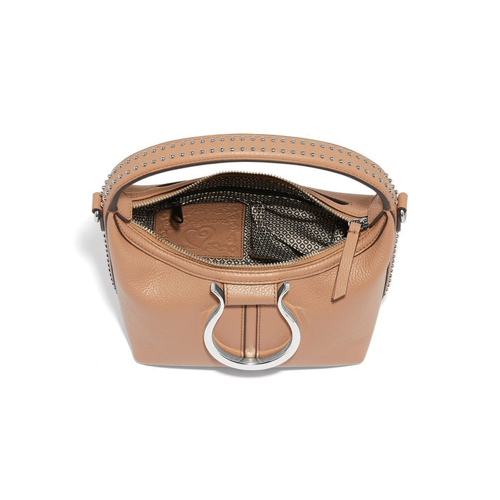 Tan leather cross body bag with silver horse bit hardware and studded strap, top view open.