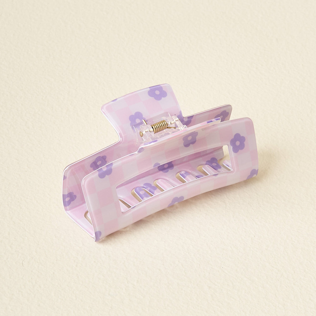Clear plastic check claw clip with printed checkerboard pattern