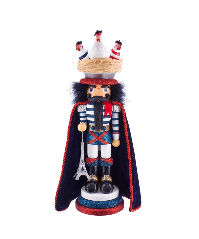 17.5-inch Hollywood Three French Hens Nutcracker with an Eiffel Tower ornament and glitter accents.