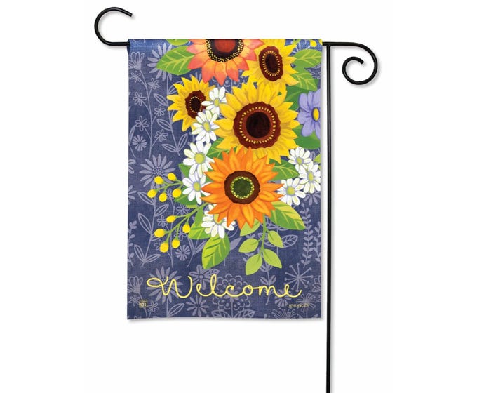 Blue garden flag with sunflowers, daisies, and the word "Welcome" in yellow script.
