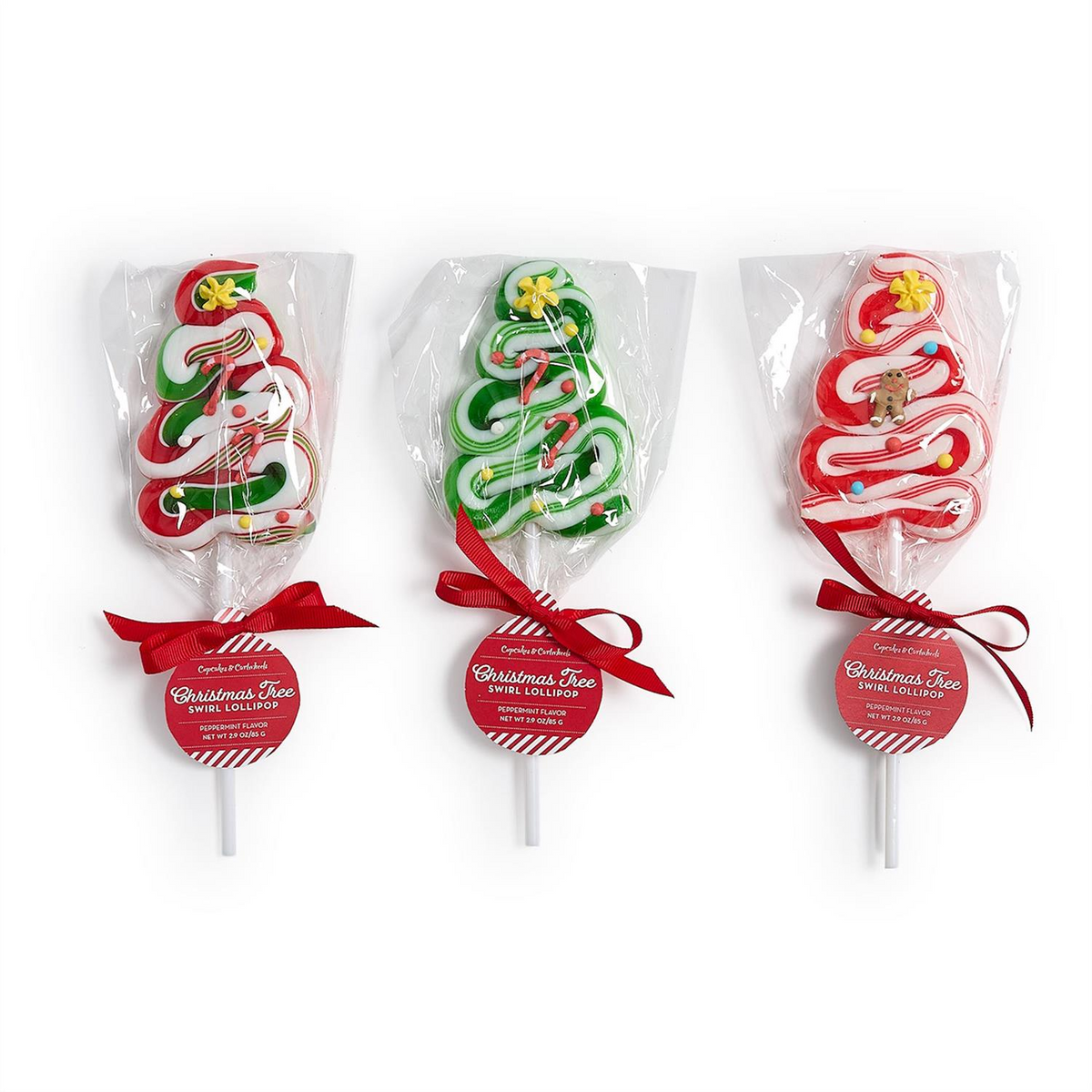 Three Christmas tree-shaped peppermint swirl lollipops in red, green, and white with icing details.