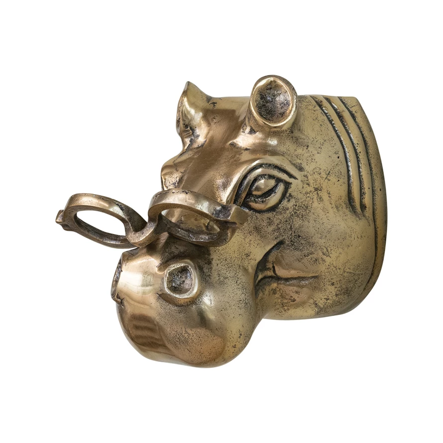 Wall décor featuring a hippo head wearing eyeglasses with natural wood finish.