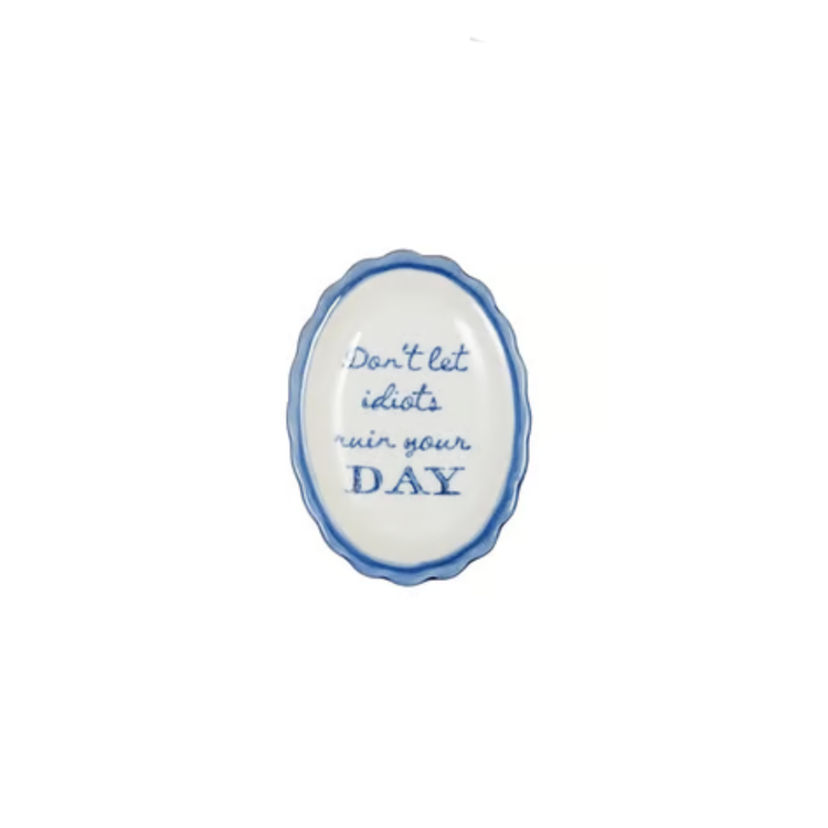 Oval scalloped stoneware dish with blue trim and text reading Don't let idiots ruin your DAY.