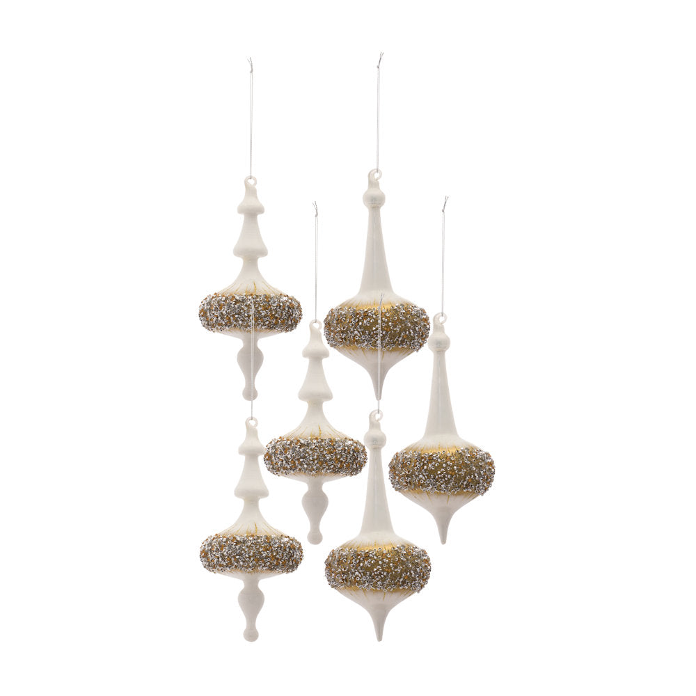 Six white finial glass ornaments with gold and silver glitter bands hanging by strings.