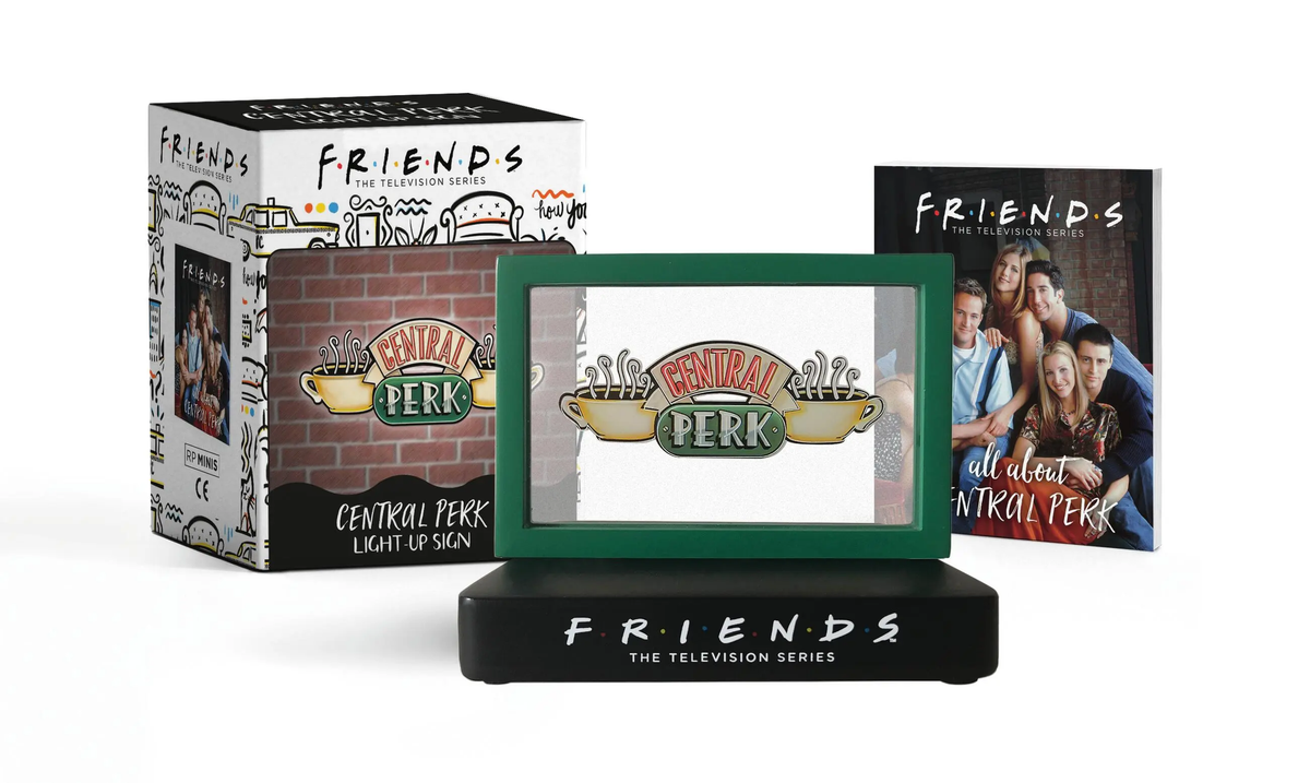 Friends: Central Perk light-up sign on a black base with a mini book and decorative box.