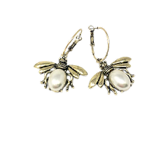 Gold hoop earrings featuring a pearl-accented honeybee pendant on one side.