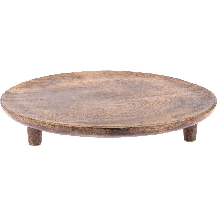 Round mango wood tray with a natural grain finish, elevated on three small wooden legs.