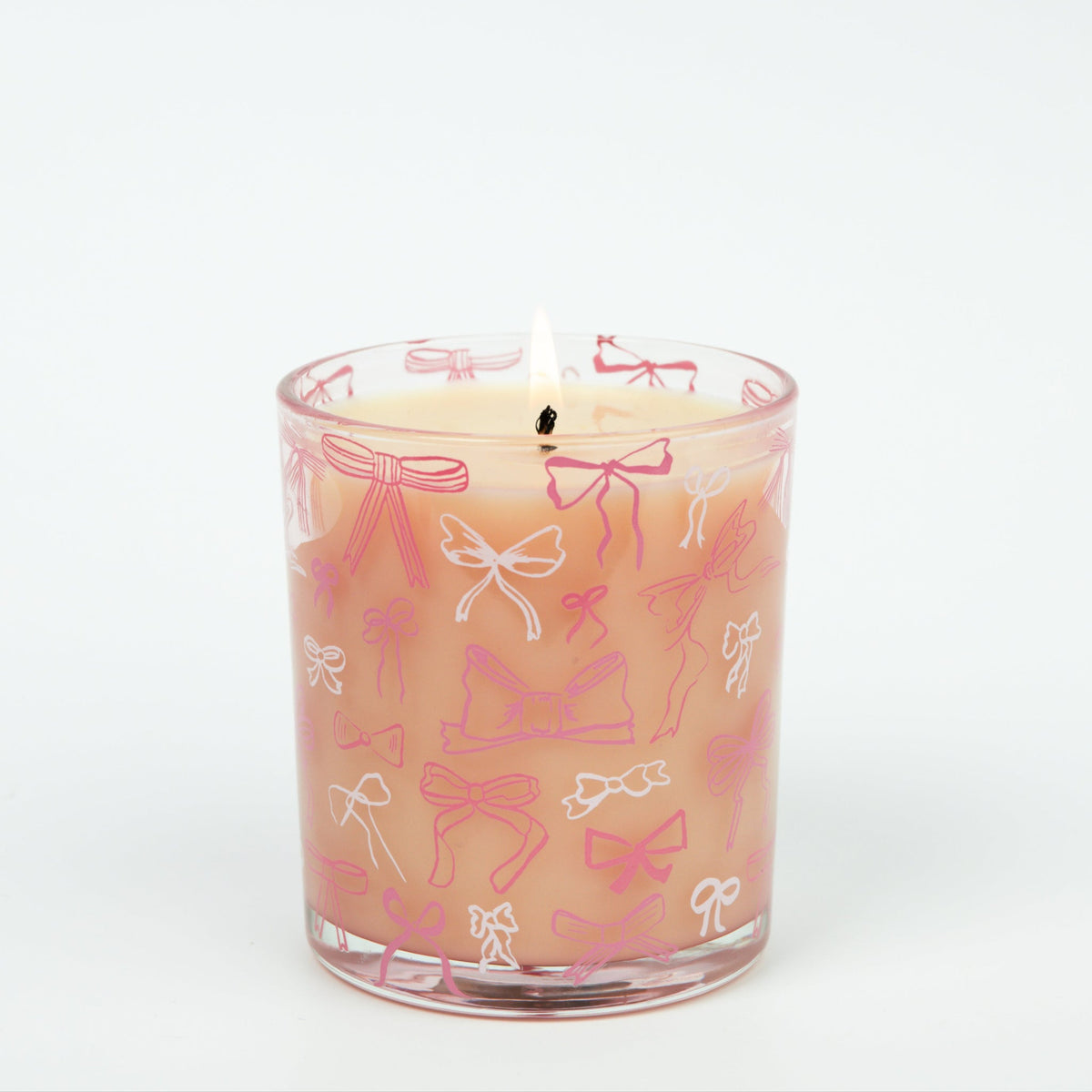 Pink Sweet Grace candle in a reusable glass vessel with an elegant bow on the lid.