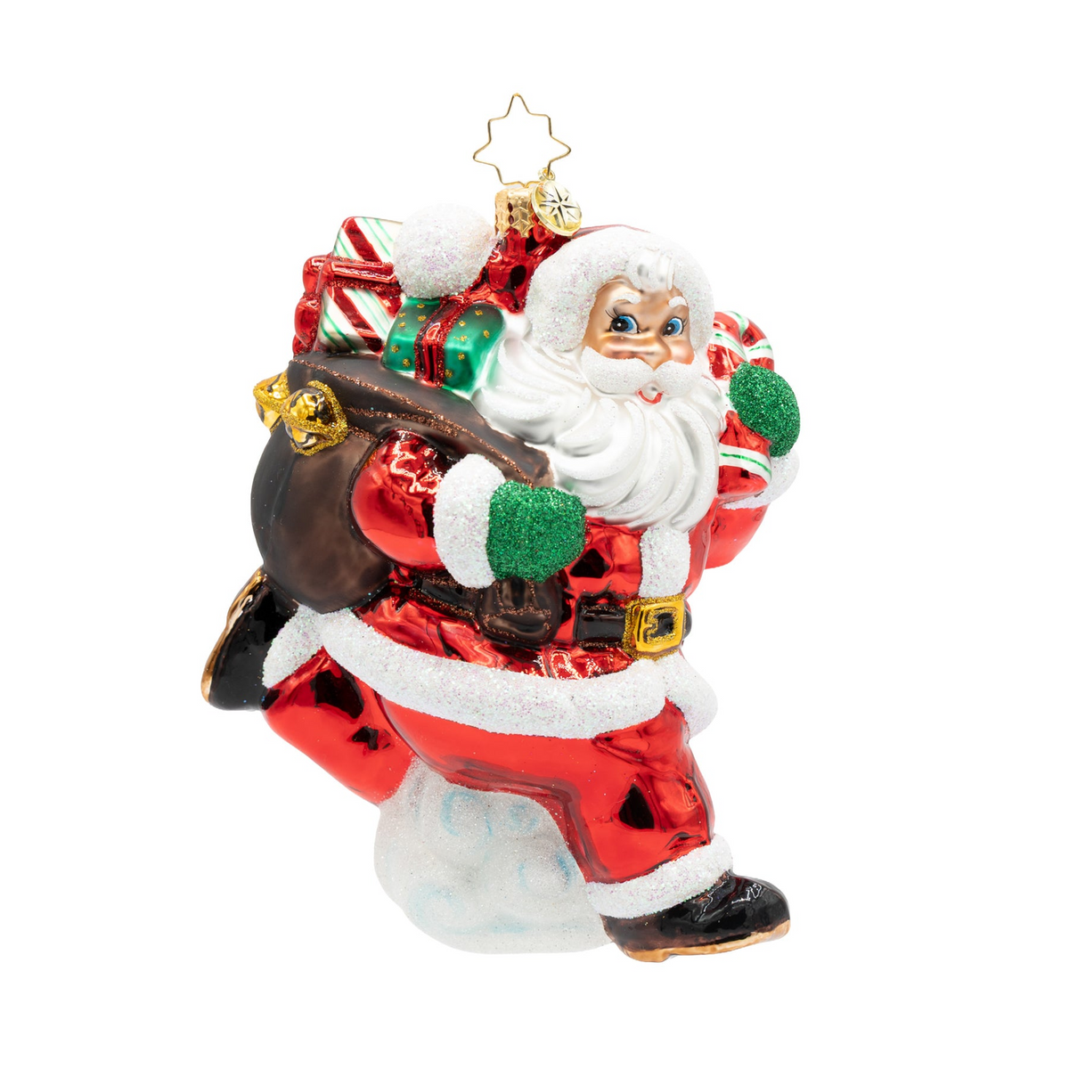 Santa Claus glass ornament carrying a sack of gifts and a candy cane, running through snow.