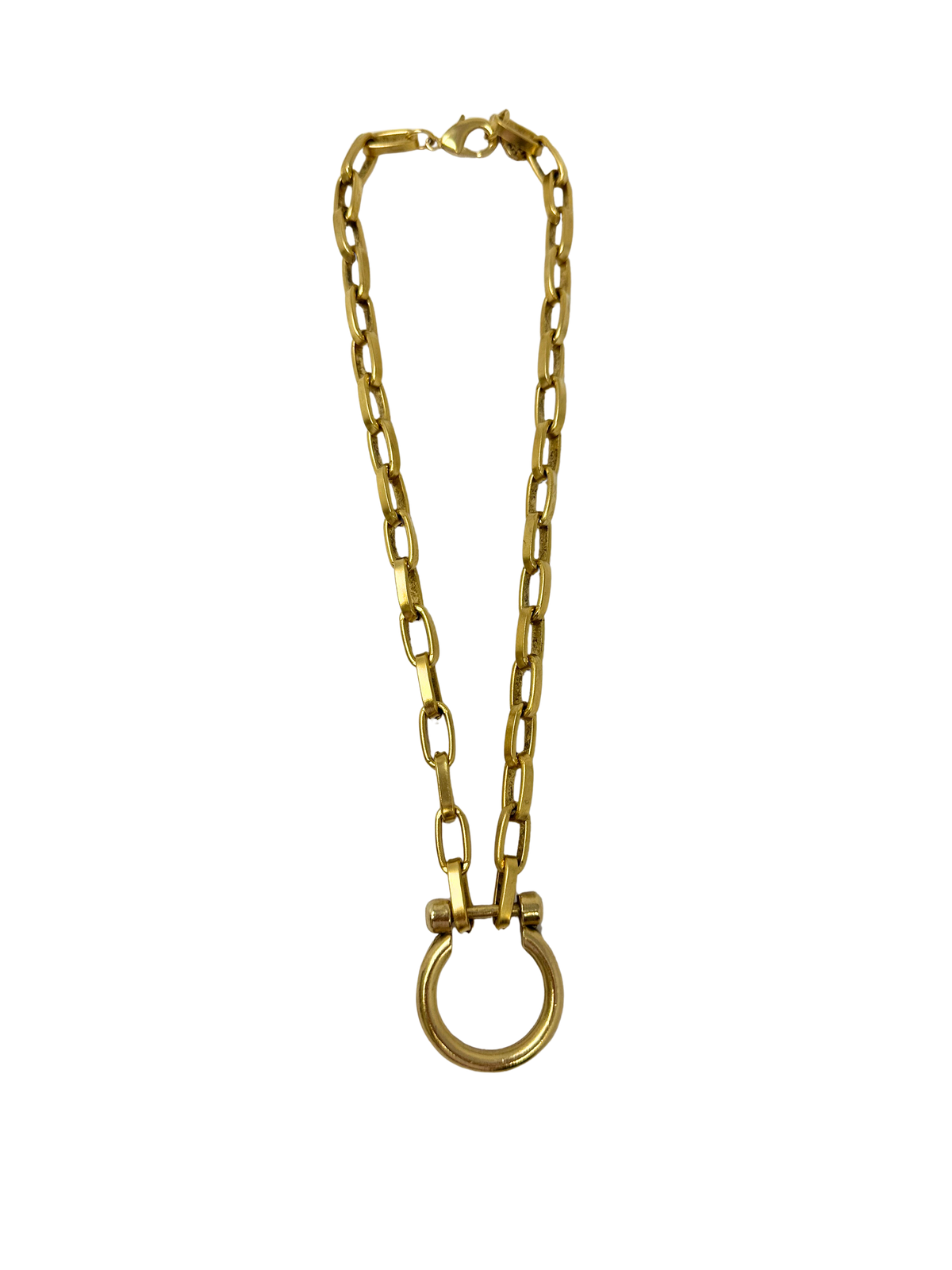 Lyla 17 inch gold chain necklace featuring a large circular toggle pendant and lobster clasp.