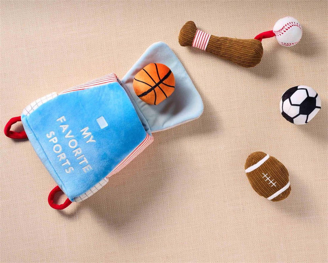Plush sports set with a blue backpack, basketball, soccer ball, football, and baseball bat.