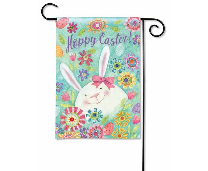 Garden flag with a smiling Easter bunny surrounded by colorful flowers and eggs. Text reads 'Hoppy Easter!'.