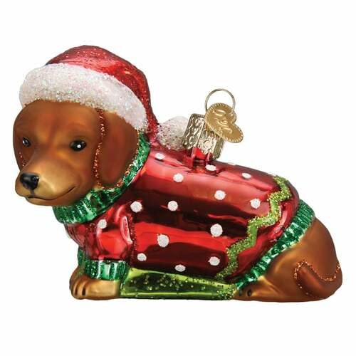 Dashing Dachshund Puppy ornament in red with white trim, black ears, and a green bow.