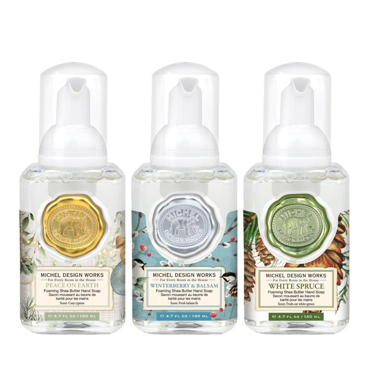 Set of three mini foaming soap dispensers in assorted colors with pump tops.